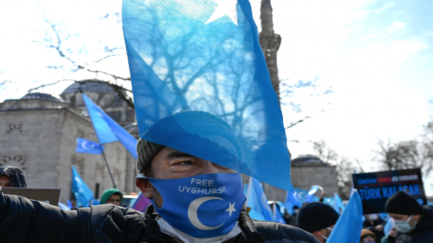 A protester from the Uyghur community living in Turkey attends a protest against the visit of China's Foreign Minister to Turkey, in Istanbul on March 25, 2021. - Hundreds protested against the Chinese official visit and what they allege is oppression by the Chinese government to Muslim Uyghurs in the far-western Xinjiang province.