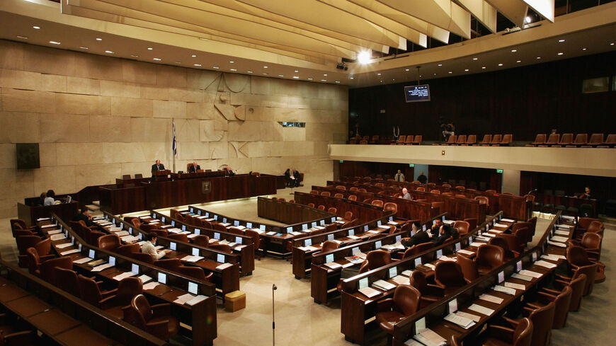 The 120-seat Knesset (Israeli parliament) chamber is virtually empty as the debate over Prime Minister Ariel Sharon's Gaza Strip disengagement plan enters its second day Oct. 25, 2004 in Jerusalem, Israel.