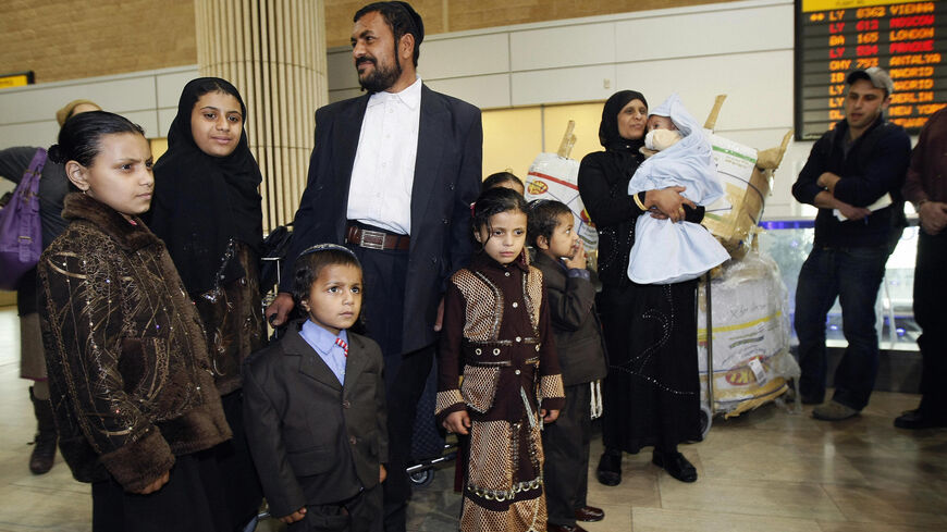 Yemeni Jew Said Ben Yisrael (C) stands with members of his family after arriving to Israel at Tel Aviv's Ben Gurion airport, on Feb. 19, 2009, after leaving Yemen for fear of attack. 