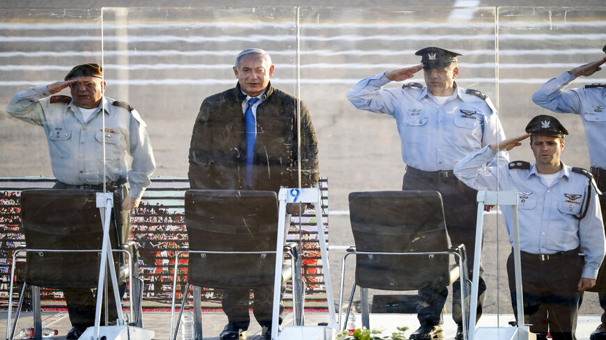 Israeli Prime Minister Benjamin Netanyahu (C-L), armed forces Chief of Staff Lt. Gen. Gadi Eizenkot (L) and air force commander Maj. Gen. Amikam Norkin (2nd-R) attend a graduation ceremony at Hatzerim Israeli Air Force base in the Negev desert, near Beer Sheva, Israel, Dec. 26, 2018.