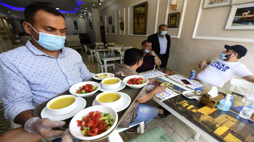 People are pictured inside a restaurant in Dubai, as the Gulf emirate moved to ease its lockdown measures amid the coronavirus pandemic, United Arab Emirates , May 26, 2020.
