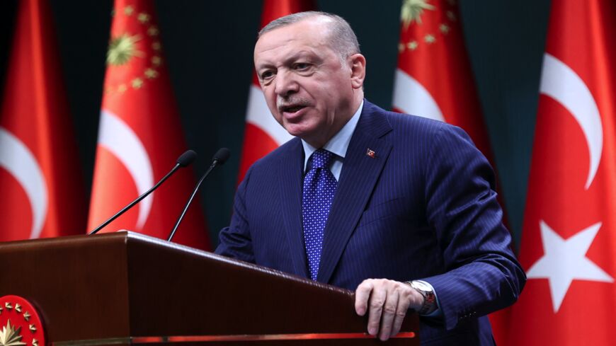 Turkish President Recep Tayyip Erdogan delivers a speech following an evaluation meeting at the Presidential Complex in Ankara on April 5, 2021. Erdogan accused dozens of retired admirals of eyeing a "political coup" by attacking his plans for a canal linking the Black Sea to the Mediterranean. Erdogan's fury was directed at a letter published by 104 former admirals over the weekend urging him to abide by the terms of the 1936 Montreux Convention. 