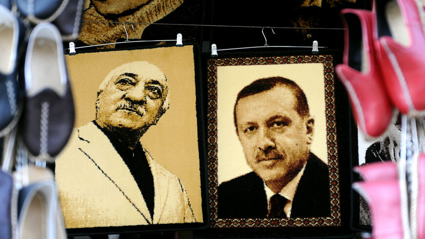 Embroidered images of United States-based Turkish cleric Fethullah Gulen (L) and Turkey's Prime Minister Recep Tayyip Erdogan (R) are displayed in a shop in a market, Gaziantep, near the Turkish-Syrian border, Jan. 17, 2014.