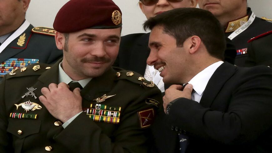 Jordanian Prince Hamzah bin al-Hussein (R) and Prince Hashem bin al-Hussein attend the opening of the Special Operations Forces Exhibition and Conference (SOFEX) in Amman on May 10, 2016.