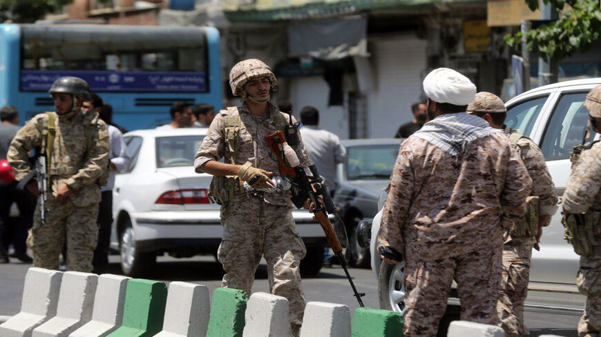 Members of the Islamic Revolutionary Guard Corps secure the area outside the Iranian parliament during an attack on the complex, Tehran, Iran, June 7, 2017.