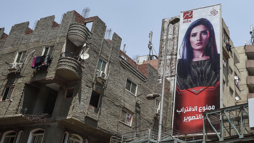 Billboards for TV Ramadan series are seen in the streets of the Egyptian capital Cairo on May 15, 2018. - Soaps and dramas normally united binge-watching Arab audiences during Ramadan but this year an Egyptian series has been caught up in a bitter dispute with Saudi Arabia over one of its star actors. 