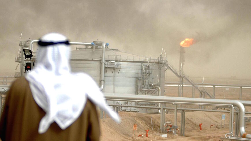 An employee of the Kuwait Oil Company (KOC) looks at 25 January 2005 the Gathering Center No.15 of al-Rawdatain field, 100 kms north of Kuwait City, following its inauguration just three years after coming under explosion.