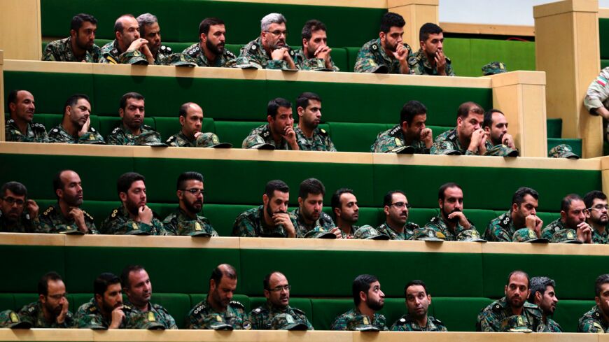 Members of the Iranian Revolutionary Guard Corps listen to a speech in parliament in Tehran on Oct. 7, 2018, about a bill to counter terrorist financing.