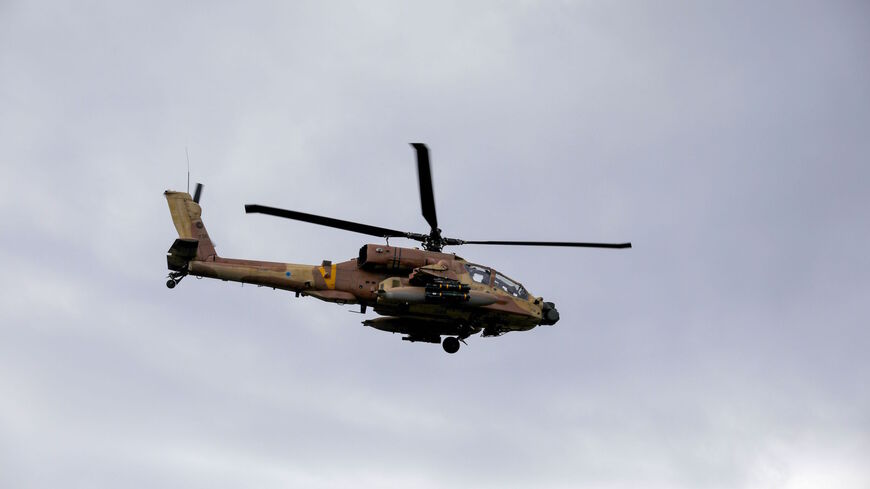 An Israeli army helicopter flies over the Israeli-annexed Golan Heights on Jan. 3, 2020. 