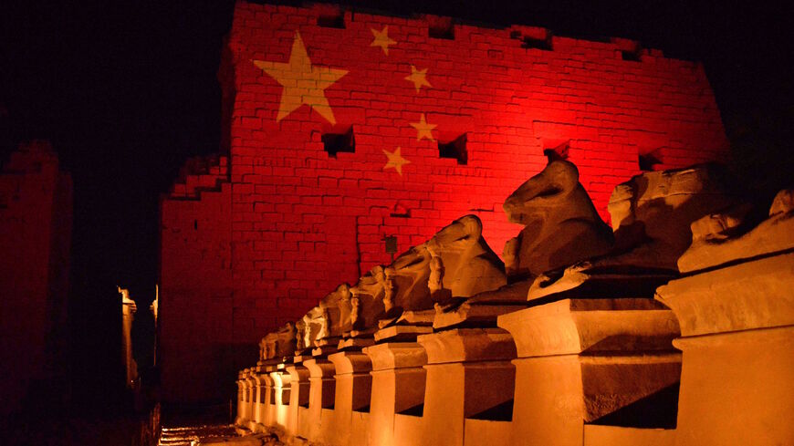 The Karnak Temple in Upper Egypt's ancient city of Luxor is pictured on March 1, 2020 with the Chinese flag in solidarity with the Chinese people amidst a world outbreak of COVID-19.
