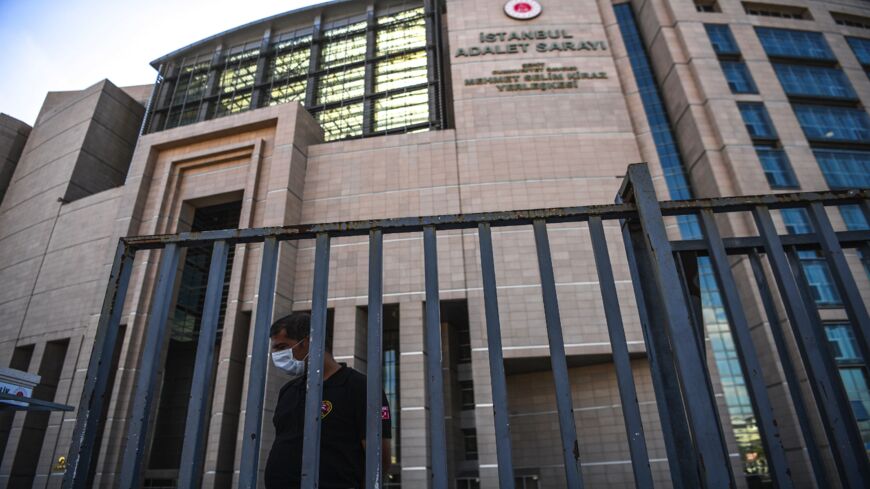 A security guard stands in front of Istanbul's courthouse on July 3, 2020, during the trial of 20 Saudi suspects accused in the murder of journalist Jamal Khashoggi in 2018 in Istanbul. The trial in absentia of 20 Saudi suspects accused of the murder, including two former aides to Saudi Crown Prince Mohammed bin Salman, began in Istanbul on July 3, 2020.