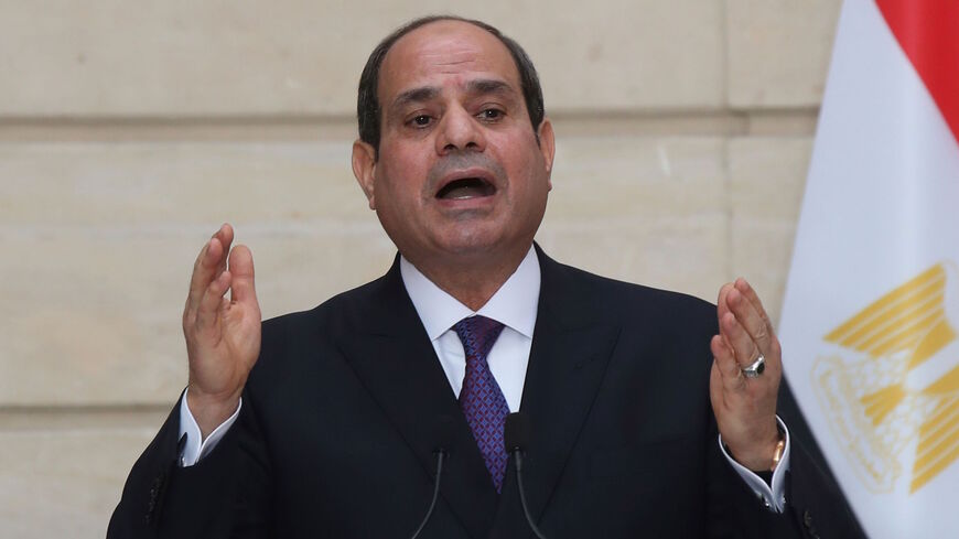 Egyptian President Abdel Fattah al-Sisi speaks during a press conference with French President following their meeting at the Elysee presidential Palace on Dec. 7, 2020 in Paris, as part of al-Sisi's three-day controversial state visit to France, with activists warning Paris not to turn a blind eye to Cairo's rights record with a red carpet welcome. 