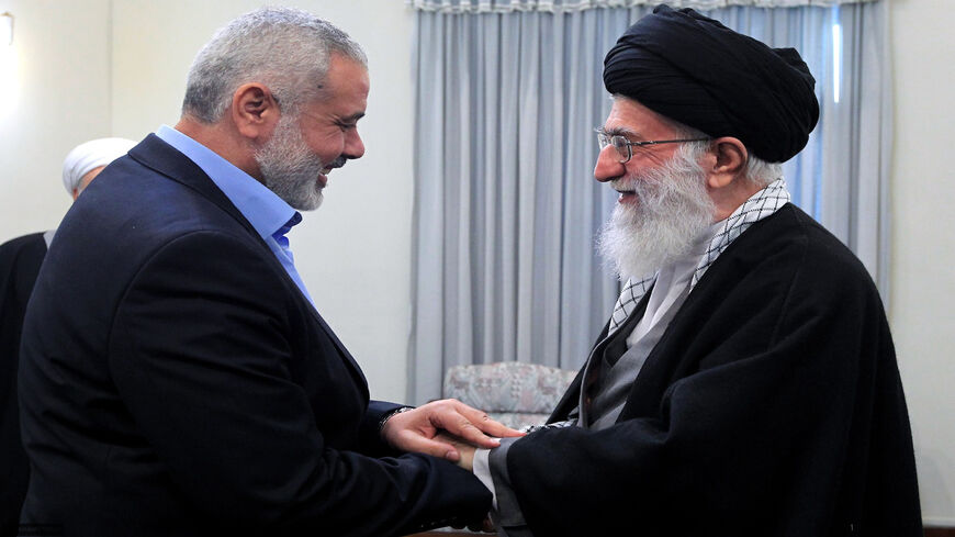 A handout photo made available by the office of Iran's supreme leader shows Iranian Supreme Leader Ayatollah Ali Khamenei greeting Ismail Haniya (L), Palestinian Hamas premier in the Gaza Strip, during a meeting in Tehran, Feb. 12, 2012.