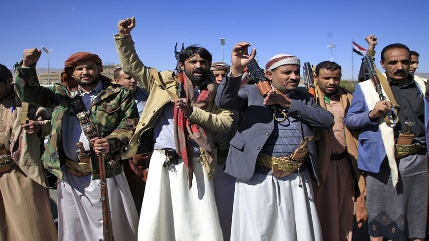 Yemeni tribesmen attend a rally denouncing the United States and the outgoing Trump administration's decision to apply the "terrorist" designation to the Iran-backed movement, in the Houthi-held capital Sanaa, Yemen, Feb. 4, 2021.