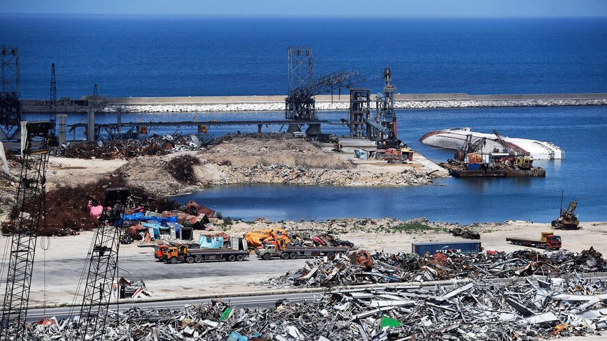 A picture shows heaps of metal scraps from the rubble of destroyed structures at the port of the Lebanese capital Beirut, on April 9, 2021, still reeling from the destruction due to a catastrophic blast in a harbor storage unit last August that killed more than 200 people and damaged swathes of the capital. 