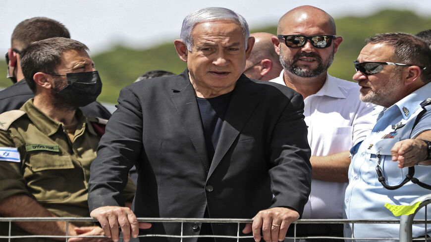 Israeli Prime Minister Benjamin Netanyahu visits the site of an overnight stampede during an ultra-Orthodox religious gathering in the northern town of Meron, Israel, April 30, 2021.