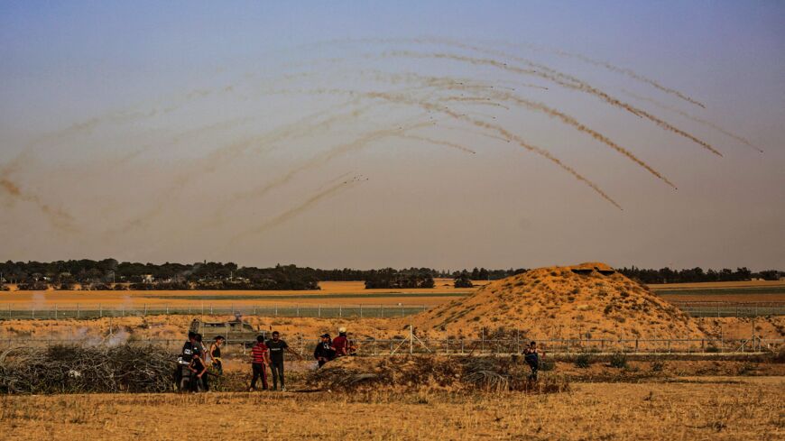 Israeli security forces fire tear gas at Palestinian protesters along the Israel-Gaza border, east of Khan Yunis town in the southern Gaza Strip on May 8, 2021. Israel braced for more protests after clashes at Jerusalem's flashpoint Al-Aqsa Mosque compound wounded more than 200 people and as the international community urged calm after days of escalating violence. The clashes came as tensions have soared over Israeli restrictions on access to parts of the Old City during Ramadan and the threat of eviction h