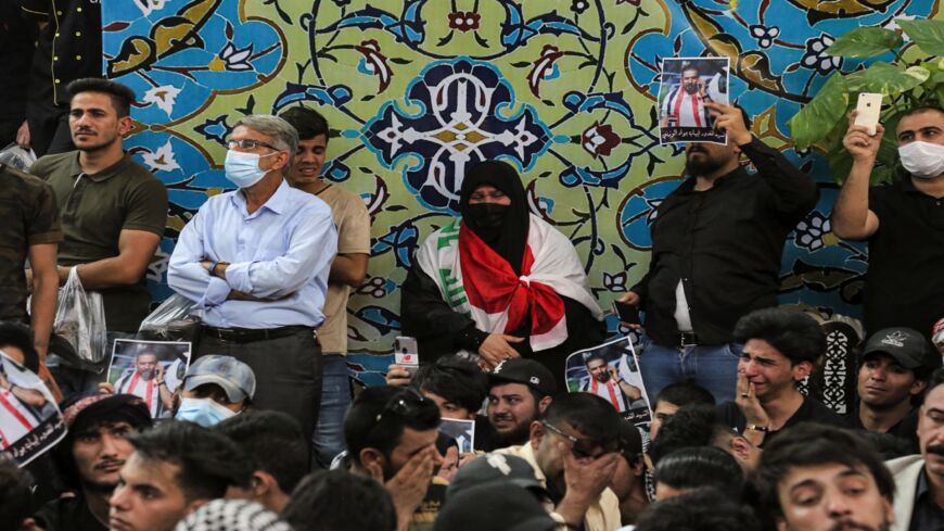 Mourners attend the funeral of assassinated Iraqi anti-government activist Ihab al-Wazni (Ehab al-Ouazni) at the Imam Hussein Shrine in the central holy shrine city of Karbala on May 9, 2021. Wazni, a coordinator of protests in the Shiite shrine city of Karbala, was a vocal opponent of corruption, the stranglehold of Tehran-linked armed groups and Iran's influence in Iraq. He was shot overnight outside his home by men on motorbikes, in an ambush caught on surveillance cameras.