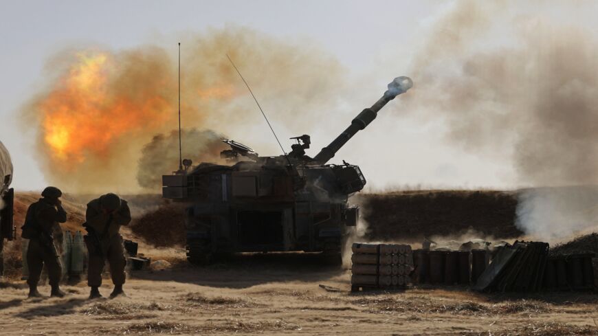 Israeli soldiers fire a 155 mm self-propelled Howitzer toward targets in the Gaza Strip from their position near the southern Israeli city of Sderot on May 12, 2021. Israel's Defense Minister Benny Gantz vowed more attacks on Hamas and other Palestinian militant groups in Gaza to bring "total, long-term quiet" before considering a cease-fire.