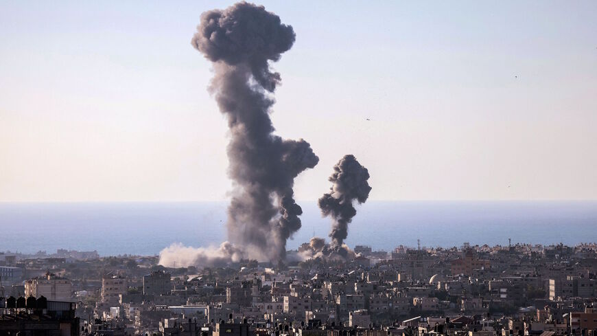 Smoke billows following an Israeli air strike in Rafah in the southern Gaza Strip on May 13, 2021. 