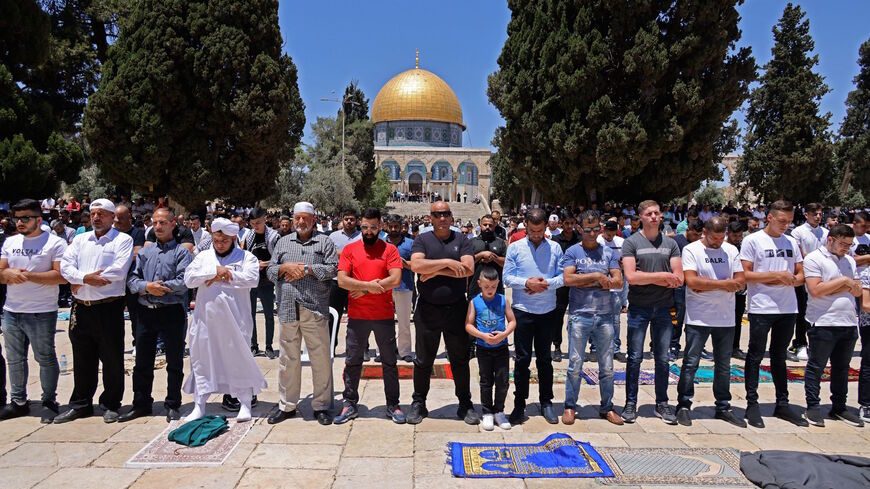 Palestinian Muslim worshippers pray at Jerusalem's al-Aqsa mosque compound, the third holiest site of Islam, on May 14, 2021.