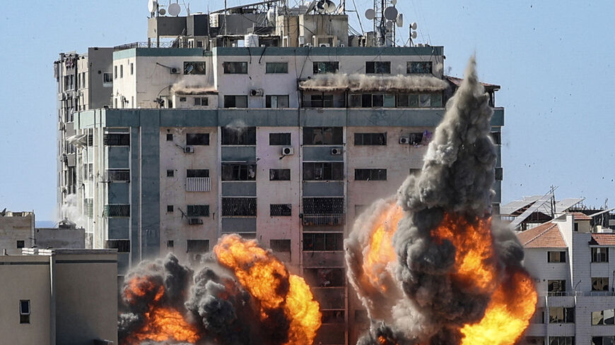 A ball of fire erupts from the Jala Tower as it is destroyed in an Israeli airstrike in Gaza City on May 15, 2021. The 13-floor Jala Tower housed the Qatar-based Al-Jazeera news and the Associated Press news agency. 