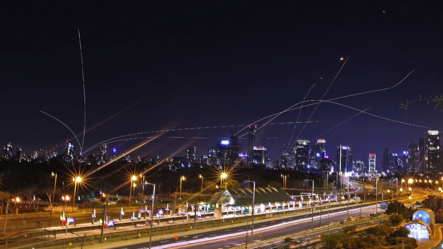 Israel's Iron Dome air defense system intercepts rockets above the coastal city of Tel Aviv on May 15, 2021, following their launching from the Gaza Strip controlled by the Palestinian Hamas movement. 