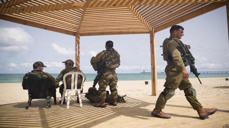 Israeli soldiers patrol Zikim beach near the border with the Gaza Strip after Israel and Hamas agreed on a cease-fire, Zikim, Israel, May 21, 2021.