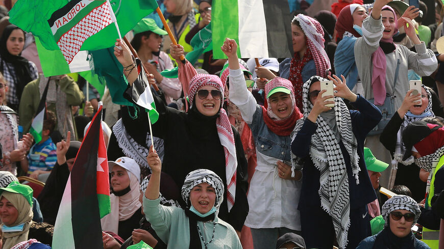 Supporters of Jordan's Muslim Brotherhood take part in a protest in the village of Sweimeh, near the Jordanian border with the occupied West Bank, on May 21, 2021, to express their solidarity with Palestinians and to celebrate the ceasefire. 