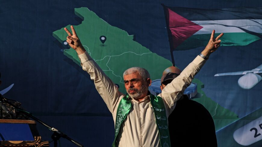 Yahya Sinwar, leader of the Palestinian Hamas movement, gestures on stage during a rally in Gaza City on May 24, 2021. A cease-fire was reached late last week after 11 days of deadly violence between Israel and the Hamas movement, which runs Gaza, stopping Israel's devastating bombardment on the overcrowded Palestinian coastal enclave.