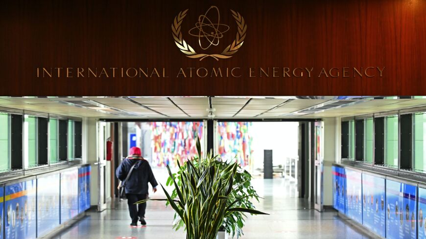 A woman walks past the sign of the International Atomic Energy Agency ahead of a press conference by Rafael Grossi, Director General of the IAEA, about the agency monitoring of Iran's nuclear energy program on May 23, 2021, in Vienna, Austria. The IAEA has been in talks with Iran over extending the agency's monitoring program. Meanwhile, Iranian and international representatives have been in talks in recent weeks in Vienna over reviving the JCPOA Iran nuclear deal.