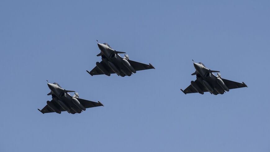 Three French made Rafale fighter jets fly with other Egyptian air force warplanes (unseen) above Cairo, on July 21, 2015.