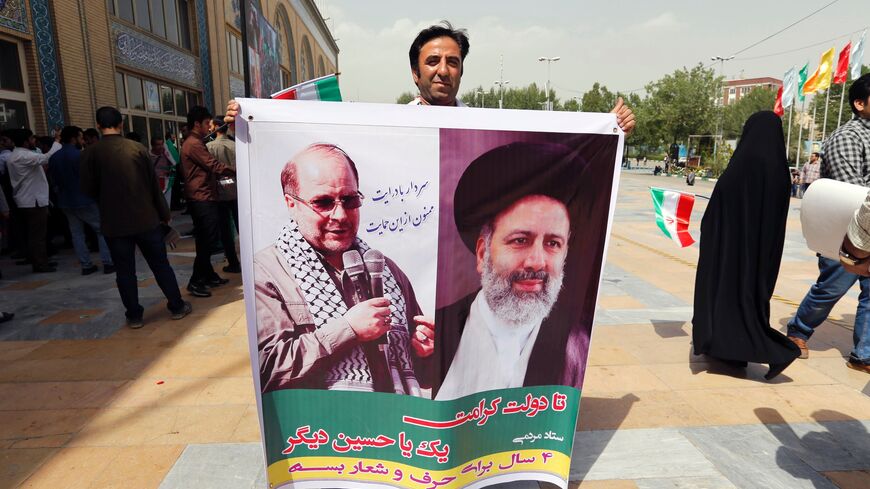 Raisi and Ghalibaf seen on poster