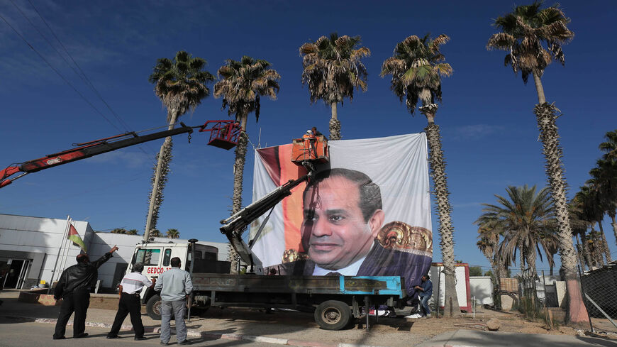 A portrait of Egyptian President Abdel Fattah al-Sisi is seen at the Rafah border crossing with Egypt, Nov. 1, 2017.