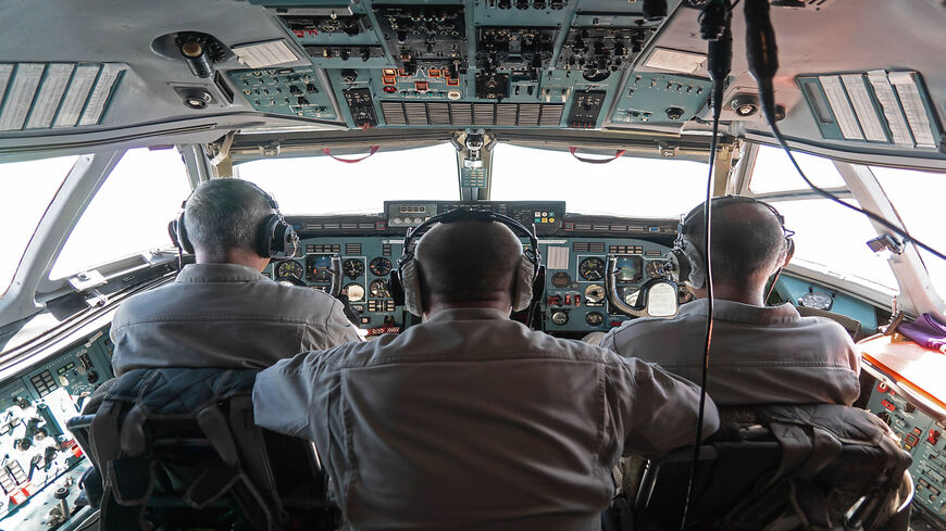 This picture taken during a guided tour by the Russian forces in Syria shows the cockpit and crew members of an Antonov 72 Russian military aircraft during a flight between Khmeimim air base and Aleppo, Syria, Aug. 16, 2018.