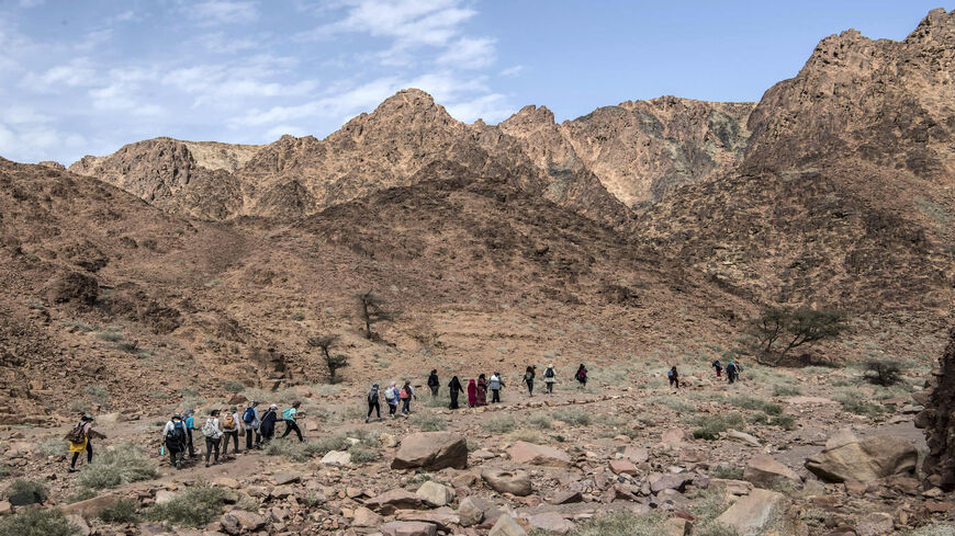 A group of hikers led by Egyptian Bedouin female guides walk in Wadi el-Sahu in the southern Sinai governorate, March 29, 2019.