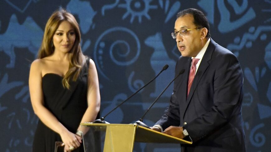 Egyptian prime minister with TV presenter