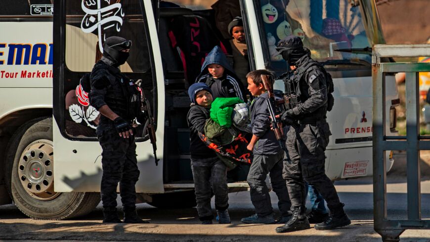 A picture taken on Feb. 6, 2020, shows some of the 35 Russian orphans linked to the Islamic State group, arriving at the de-facto Syrian Kurdish capital of Qamishli after being transferred from al-Hol camp in northeastern Syria. 