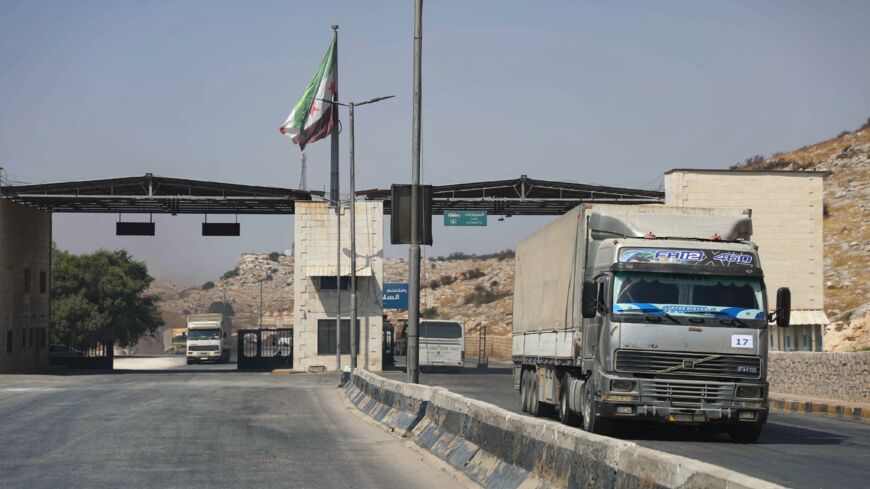 International humanitarian aid trucks cross into Syria's northwestern Idlib province through the Bab al-Hawa border crossing with Turkey, on Sept. 7, 2020. 