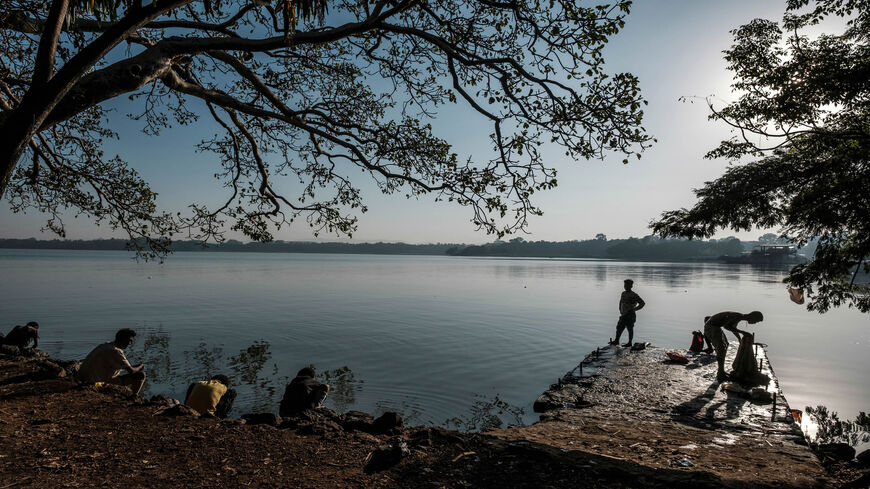 People wash clothes and bath on the shore of Lake Tana, in Bahir Dar, Ethiopia, Nov. 11, 2020.