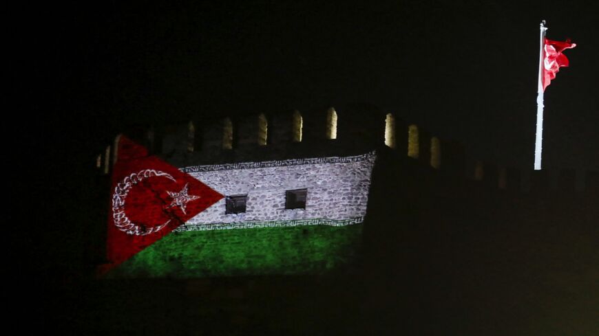 This photograph taken on May 14, 2014, shows a Gaza-Turkey solidarity flag projected on a wall of the Ankara Castle in Ankara, Turkey.
