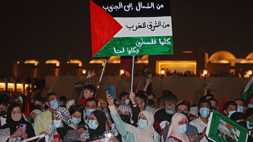 People rally in solidarity with the Palestinians outside Imam Muhammad Abdel-Wahhab Mosque in the Qatari capital Doha on May 15, 2021. 