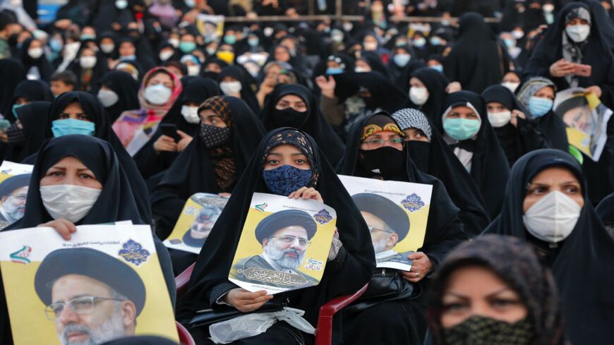 Women supporters of Iranian presidential candidate Ebrahim Raisi hold up his posters during an election campaign rally in the city of Eslamshahr, about 25 kilometers south of the center of the capital, Tehran, on June 6, 2021. The 60-year-old ultra-conservative Raisi, widely seen as the favorite to win the June 18 presidential election, heads the judiciary and is a "hodjatoleslam," one rank below that of ayatollah in the Shiite clerical hierarchy. 