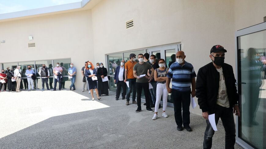 people line up for Pfizer vaccine in Ankara