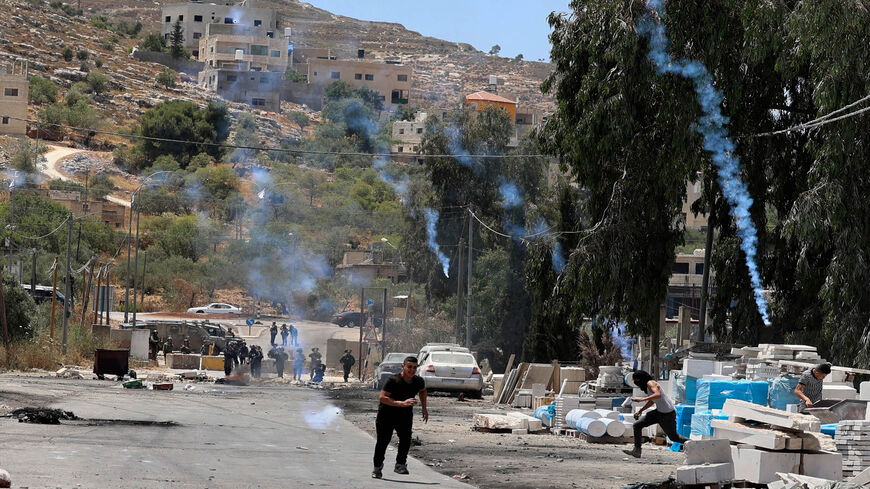 Palestinian youths clash with Israeli security forces in the village of Beita, south of Nablus, West Bank, June 8, 2021.