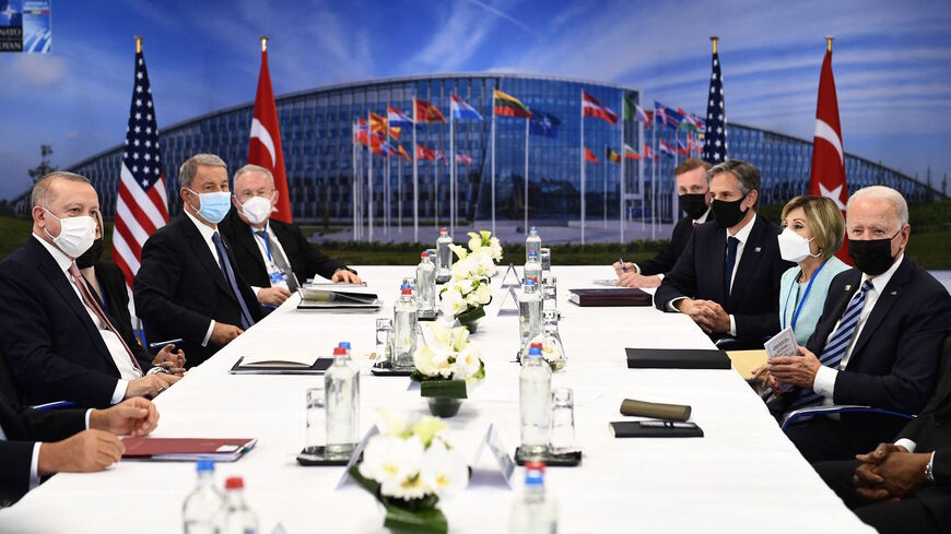 Turkey's President Recep Tayyip Erdogan (L) and US President Joe Biden (R) attend a bilateral meeting on the sidelines of the NATO summit at the North Atlantic Treaty Organization (NATO) headquarters in Brussels on June 14, 2021.