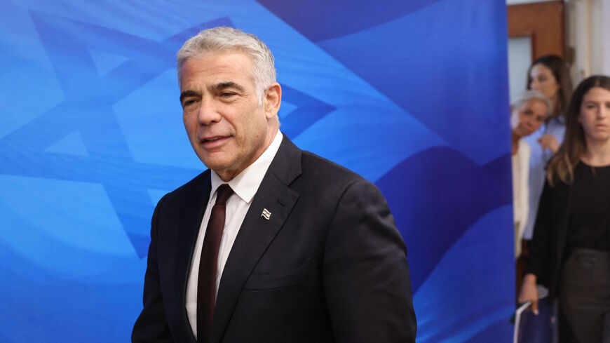 Israeli alternate prime minister and Foreign Minister Yair Lapid arrives to chair the first weekly cabinet meeting of his new government in Jerusalem, on June 20, 2021.