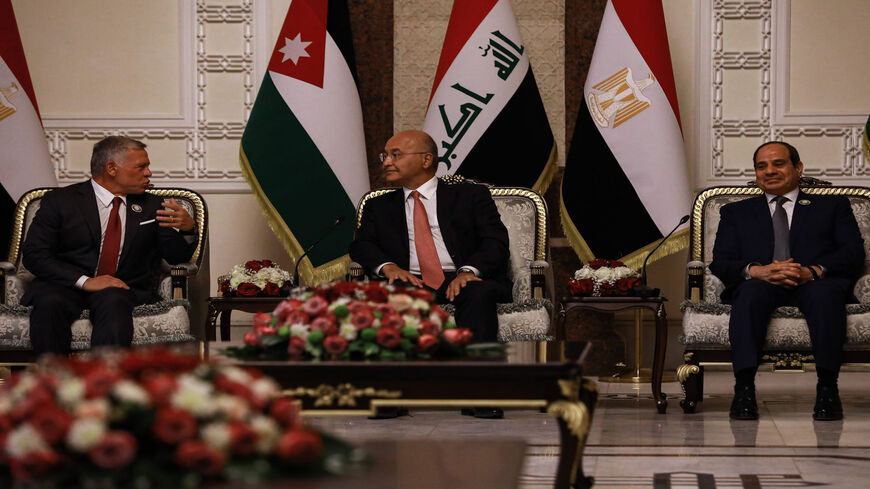 (L-R) King Abdullah II of Jordan, Iraqi President Barham Salih and Egyptian President Abdel Fattah al-Sisi attend a meeting at the Republican Palace on the sidelines of the Iraqi-Egyptian-Jordanian tripartite summit, Baghdad, Iraq, June 27, 2021.