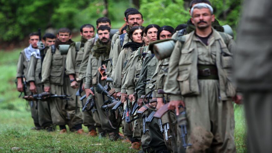 Kurdistan Workers Party (PKK) fighters arrive in the northern Iraqi city of Dahuk on May 14, 2013.