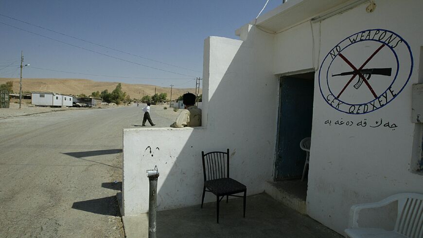 The entrance of the UNHCR Makhmour refugee camp, controlled by the PKK (Kurdistan Workers Party), is seen Sept. 4, 2003. Journalists have been barred from the site as well as all arms since PKK militants were banned from carrying arms by the United States in Iraq.